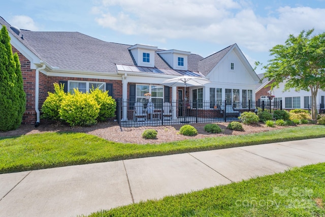 148 Adelaide Way, Rock Hill, SC 29732 - view of front of home featuring brick siding, fence, roof with shingles, and board and batten siding