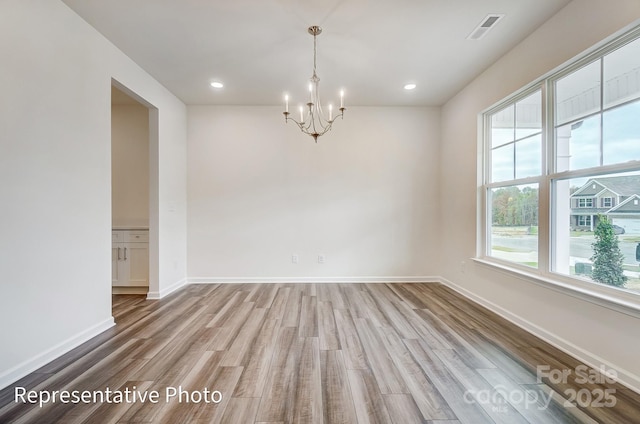 2233 Tabor Rd Unit 586, Sherrills Ford, NC 28673 - empty room featuring a chandelier, wood finished floors, baseboards, and recessed lighting