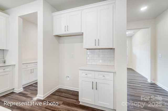2233 Tabor Rd Unit 586, Sherrills Ford, NC 28673 - kitchen with dark wood-style flooring, decorative backsplash, white cabinetry, light countertops, and baseboards