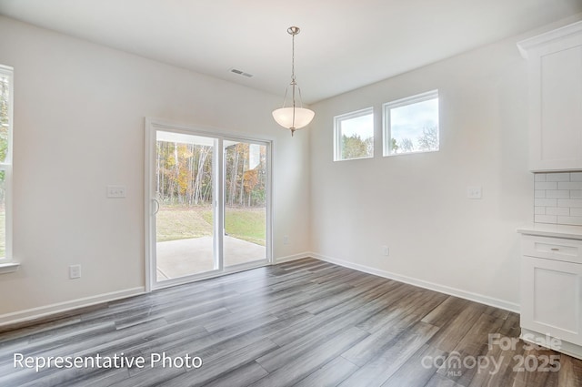 2233 Tabor Rd Unit 586, Sherrills Ford, NC 28673 - unfurnished dining area featuring wood finished floors and baseboards