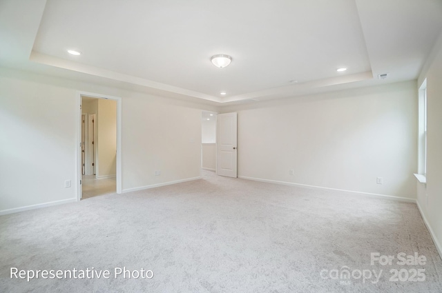 2233 Tabor Rd Unit 586, Sherrills Ford, NC 28673 - spare room featuring a raised ceiling, recessed lighting, and baseboards