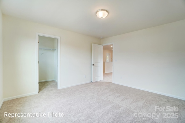 2233 Tabor Rd Unit 586, Sherrills Ford, NC 28673 - unfurnished bedroom with carpet floors, baseboards, and a spacious closet