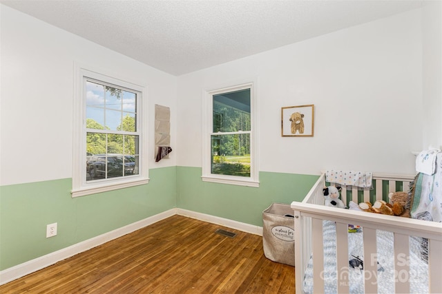 875 Marys Grove Rd, Cherryville, NC 28021 - bedroom featuring wood finished floors, baseboards, and a textured ceiling