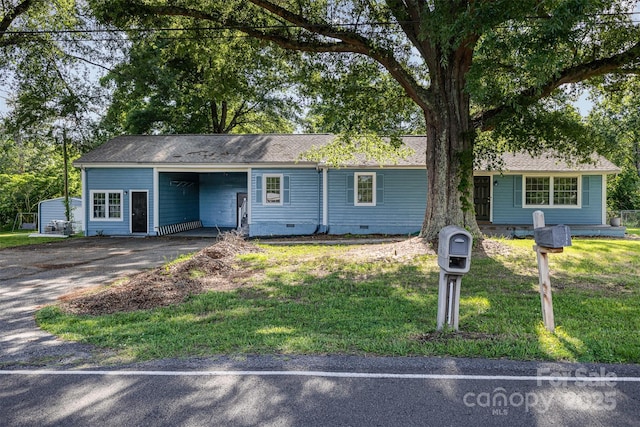 875 Marys Grove Rd, Cherryville, NC 28021 - ranch-style home featuring asphalt driveway, crawl space, a carport, and a front yard