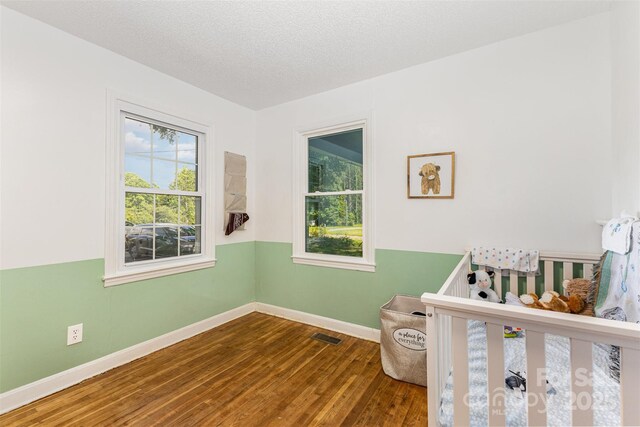 875 Marys Grove Rd, Cherryville, NC 28021 - bedroom with wood finished floors and a textured ceiling