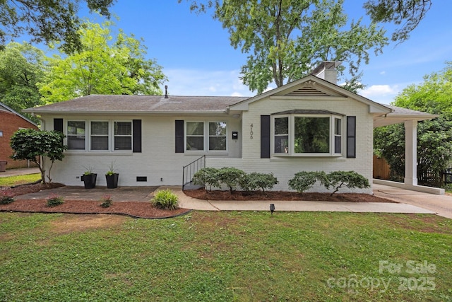 4106 Castlewood Rd, Charlotte, NC 28209 - single story home with a front lawn, brick siding, driveway, and roof with shingles