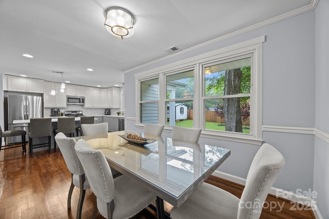 4106 Castlewood Rd, Charlotte, NC 28209 - dining room featuring dark wood-type flooring, baseboards, ornamental molding, and recessed lighting