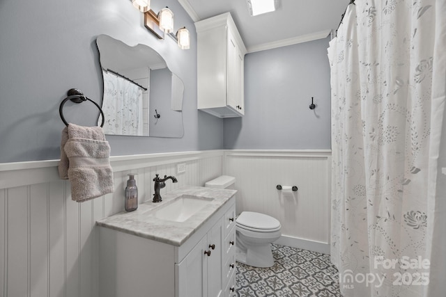 4106 Castlewood Rd, Charlotte, NC 28209 - bathroom with vanity, crown molding, toilet, a wainscoted wall, and a shower with shower curtain