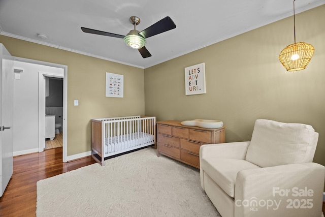 4106 Castlewood Rd, Charlotte, NC 28209 - bedroom with crown molding, wood finished floors, baseboards, and a ceiling fan