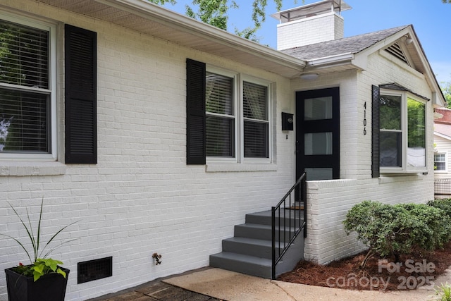 4106 Castlewood Rd, Charlotte, NC 28209 - view of exterior entry with brick siding and crawl space