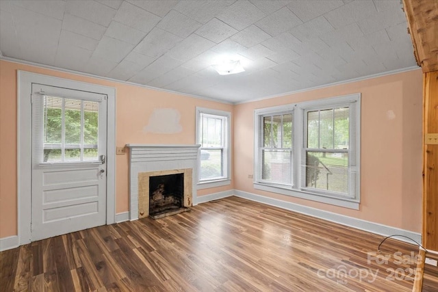 24515 Saint Martin Rd, Albemarle, NC 28001 - unfurnished living room featuring crown molding, a brick fireplace, baseboards, and plenty of natural light