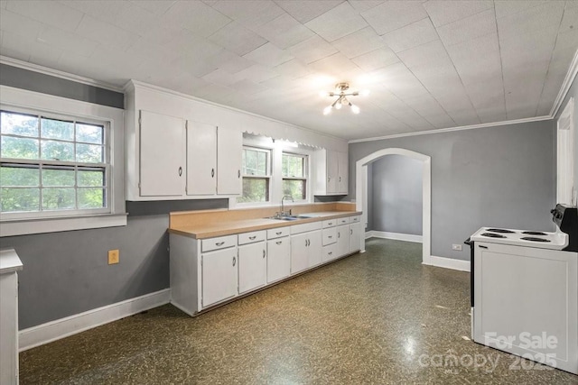24515 Saint Martin Rd, Albemarle, NC 28001 - kitchen featuring electric stove, arched walkways, crown molding, white cabinetry, and baseboards