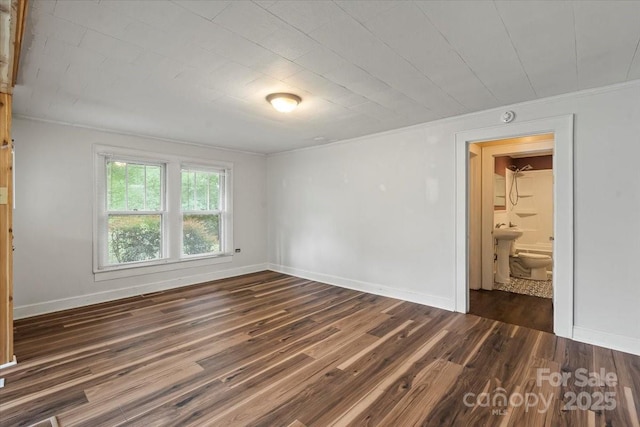 24515 Saint Martin Rd, Albemarle, NC 28001 - unfurnished room featuring crown molding, dark wood-type flooring, and baseboards