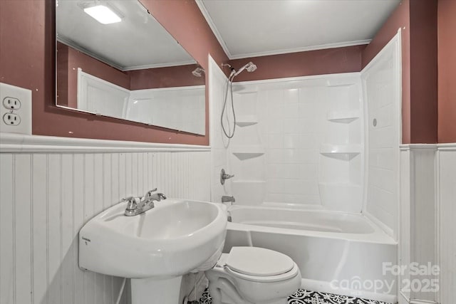 24515 Saint Martin Rd, Albemarle, NC 28001 - bathroom with wainscoting, toilet, shower / tub combination, and a sink