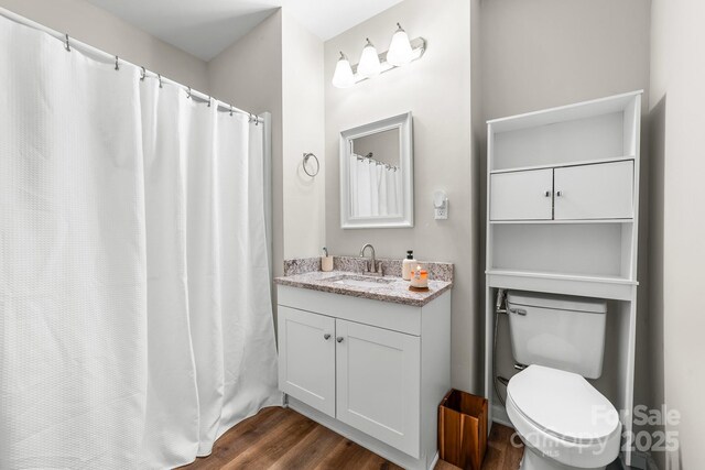 3716 Hamilton Dr, Gastonia, NC 28052 - bathroom featuring wood finished floors, vanity, and toilet