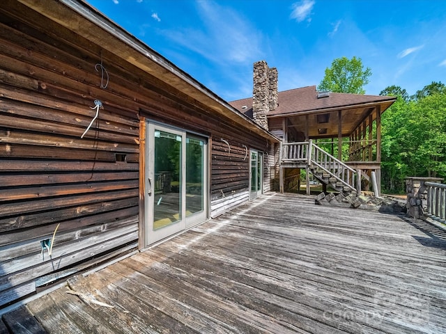 wooden terrace featuring stairs