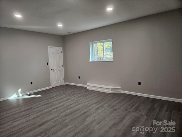 7154 Woodcock Trl, Stanley, NC 28164 - empty room with dark wood-style flooring, recessed lighting, and baseboards