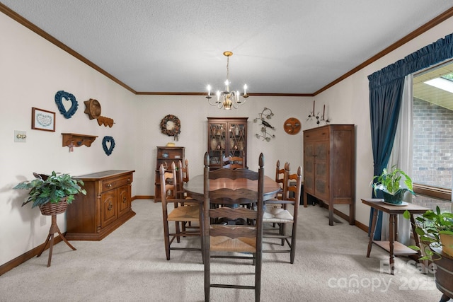dining area with crown molding, a chandelier, light carpet, and baseboards