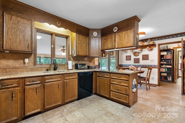 2448 Moss Farm Rd, Hickory, NC 28602 - kitchen with dishwasher, a sink, brown cabinets, a textured ceiling, and backsplash