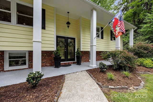 931 Indian Hill Rd, Hendersonville, NC 28791 - entrance to property with covered porch and french doors