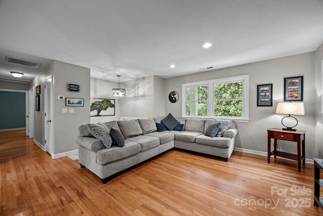 931 Indian Hill Rd, Hendersonville, NC 28791 - living room featuring light wood finished floors, baseboards, and recessed lighting