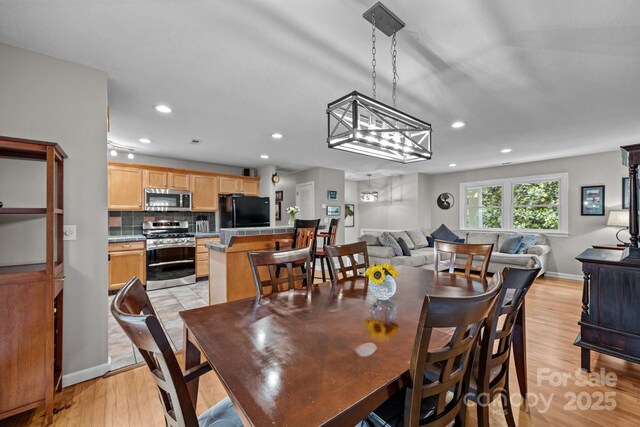 931 Indian Hill Rd, Hendersonville, NC 28791 - dining space with recessed lighting, light wood-style floors, baseboards, and a chandelier