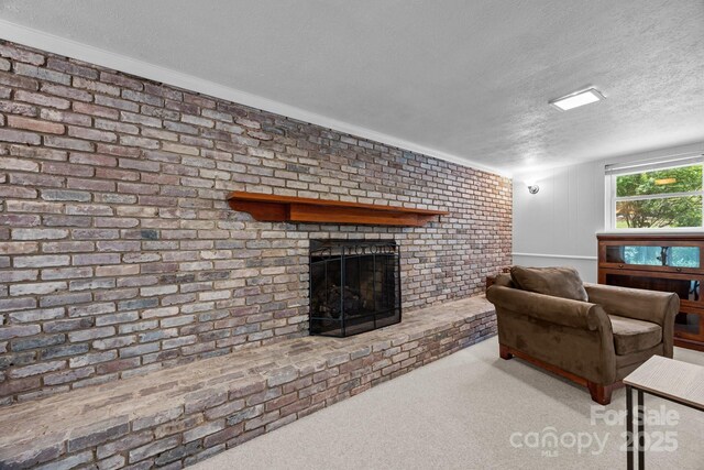 931 Indian Hill Rd, Hendersonville, NC 28791 - carpeted living room with a textured ceiling, a brick fireplace, and brick wall
