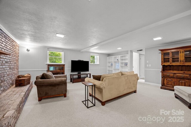 931 Indian Hill Rd, Hendersonville, NC 28791 - living room featuring carpet flooring, a textured ceiling, and a fireplace