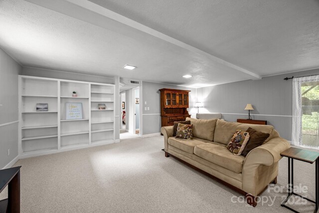 931 Indian Hill Rd, Hendersonville, NC 28791 - carpeted living room with a textured ceiling and baseboards