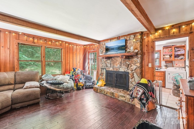 8504 Knollwood Cir, Charlotte, NC 28213 - living room with beamed ceiling, separate washer and dryer, wooden walls, a stone fireplace, and wood finished floors