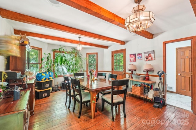 8504 Knollwood Cir, Charlotte, NC 28213 - dining area featuring plenty of natural light, hardwood / wood-style floors, beam ceiling, and a chandelier