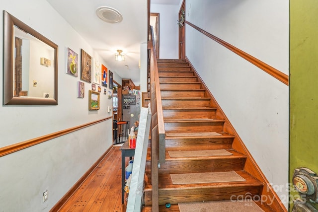 8504 Knollwood Cir, Charlotte, NC 28213 - stairs featuring hardwood / wood-style floors