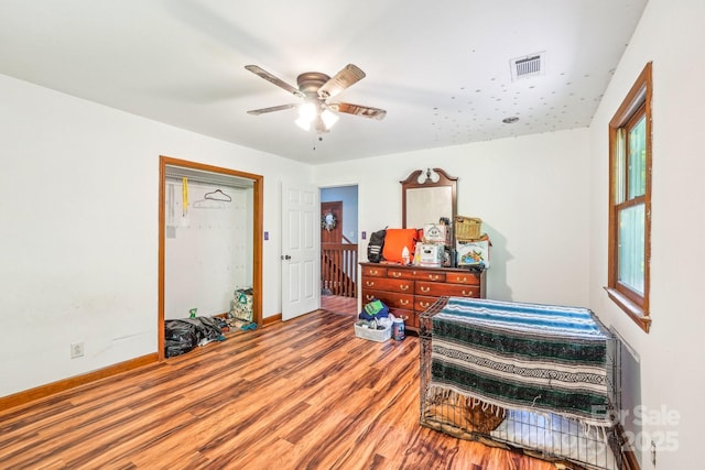 8504 Knollwood Cir, Charlotte, NC 28213 - bedroom with wood finished floors, baseboards, ceiling fan, and multiple windows