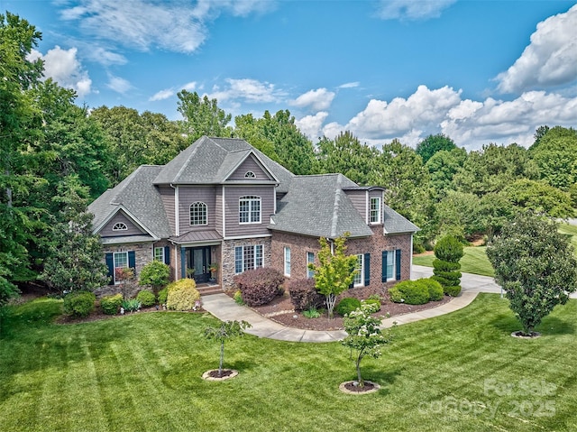 5826 Natoma Rd, Lake Wylie, SC 29710 - view of front of property featuring a front yard, stone siding, and roof with shingles
