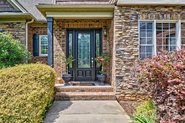 5826 Natoma Rd, Lake Wylie, SC 29710 - property entrance with stone siding, brick siding, and roof with shingles