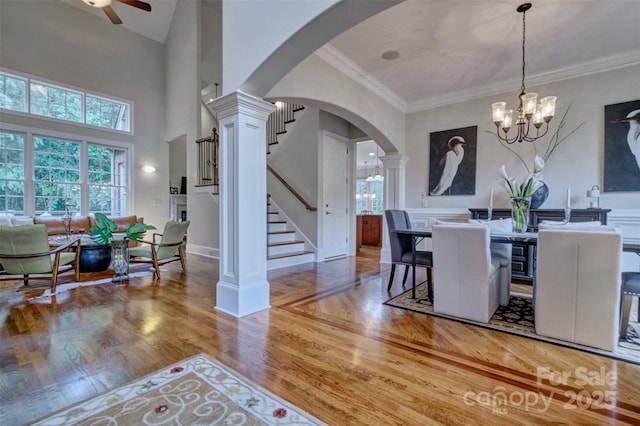 5826 Natoma Rd, Lake Wylie, SC 29710 - dining space featuring stairway, wood finished floors, a ceiling fan, plenty of natural light, and ornamental molding
