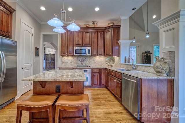 5826 Natoma Rd, Lake Wylie, SC 29710 - kitchen with stainless steel appliances, arched walkways, light stone counters, decorative backsplash, and recessed lighting