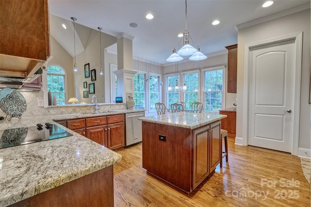 5826 Natoma Rd, Lake Wylie, SC 29710 - kitchen featuring stainless steel dishwasher, ornamental molding, black electric stovetop, light wood finished floors, and brown cabinetry