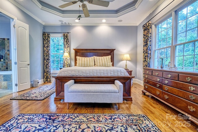 5826 Natoma Rd, Lake Wylie, SC 29710 - bedroom featuring a tray ceiling, wood finished floors, ornamental molding, and ceiling fan