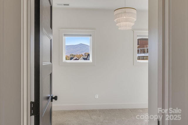203 Boleyn Dr, Black Mountain, NC 28711 - unfurnished room featuring carpet floors, baseboards, and a chandelier