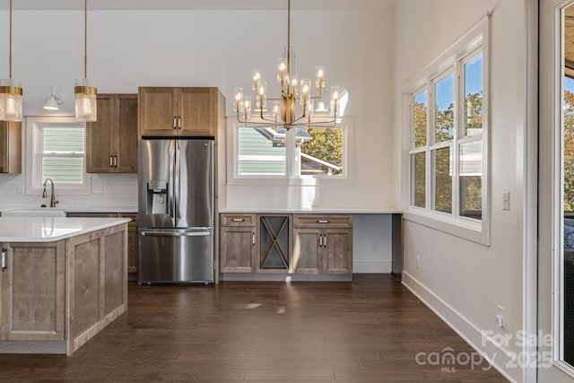 203 Boleyn Dr, Black Mountain, NC 28711 - kitchen featuring stainless steel fridge, a sink, dark wood-type flooring, a chandelier, and decorative backsplash