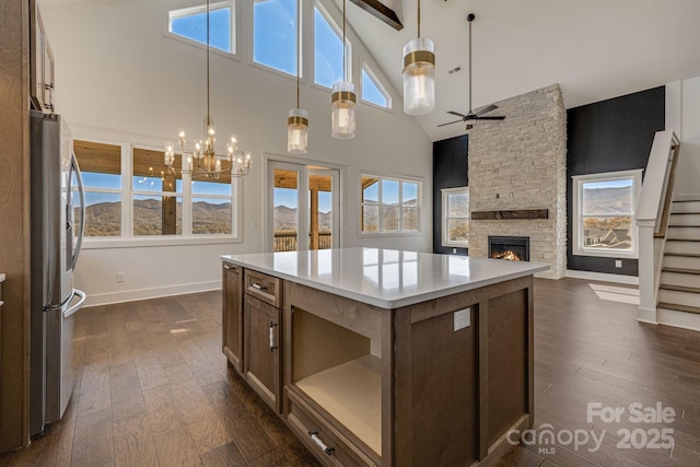 203 Boleyn Dr, Black Mountain, NC 28711 - kitchen with stainless steel fridge, dark wood-style floors, a high ceiling, ceiling fan, and baseboards