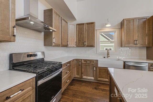 203 Boleyn Dr, Black Mountain, NC 28711 - kitchen with appliances with stainless steel finishes, wall chimney exhaust hood, a sink, dark wood-style flooring, and decorative backsplash