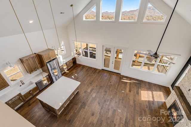 203 Boleyn Dr, Black Mountain, NC 28711 - living room with high vaulted ceiling, dark wood-style floors, plenty of natural light, a fireplace, and recessed lighting