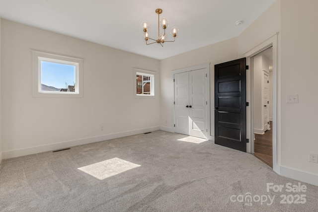 203 Boleyn Dr, Black Mountain, NC 28711 - unfurnished bedroom with carpet floors, multiple windows, and baseboards