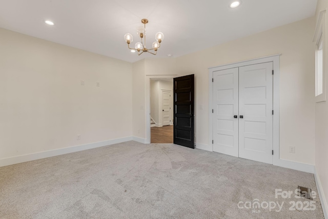203 Boleyn Dr, Black Mountain, NC 28711 - unfurnished bedroom featuring carpet, a chandelier, recessed lighting, baseboards, and a closet