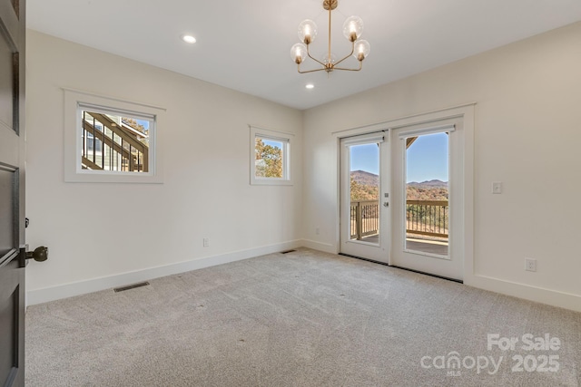 203 Boleyn Dr, Black Mountain, NC 28711 - spare room with carpet flooring, a chandelier, baseboards, and recessed lighting