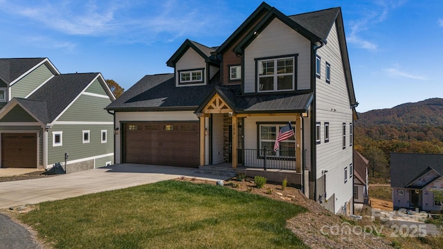 203 Boleyn Dr, Black Mountain, NC 28711 - craftsman house with a porch, driveway, an attached garage, a front yard, and a mountain view