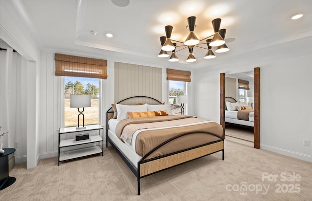 bedroom with a chandelier, baseboards, light carpet, recessed lighting, and a tray ceiling
