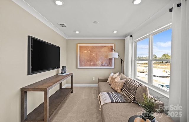 carpeted living area featuring recessed lighting, baseboards, and crown molding